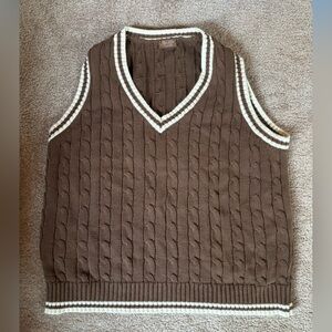 Brown knit sweater vest with white stitching